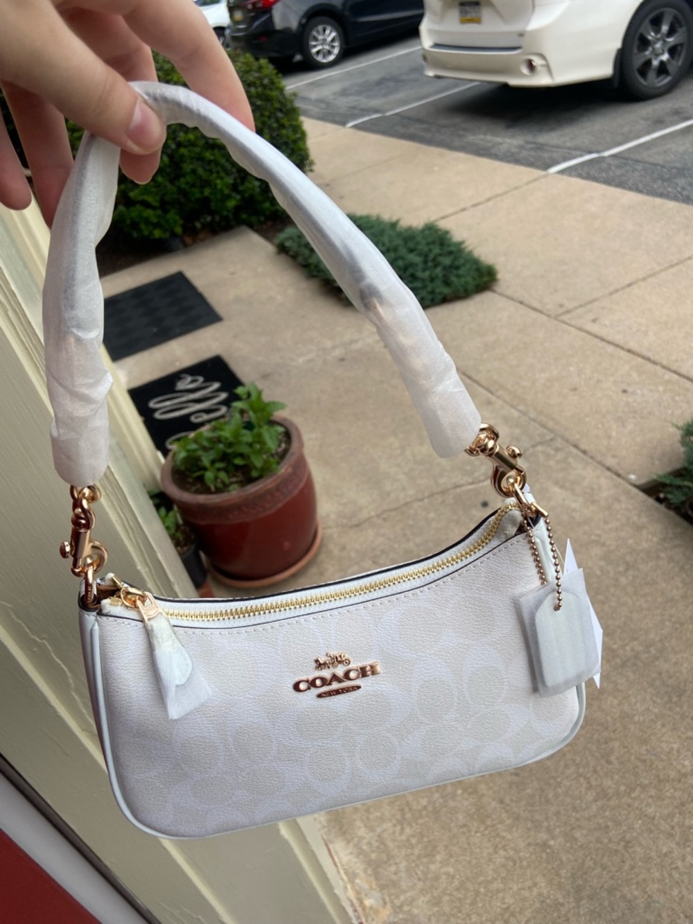 Coach White Signature Canvas Shoulder Bag with Gold Hardware Accent